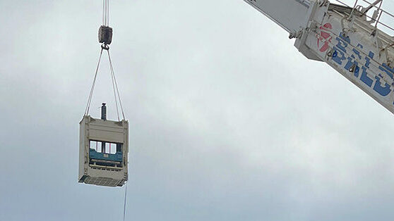 Machine installation by crane through the building roof